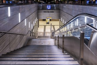 Night photo, long exposure with motion blur, modern underground entrance at Unter den Linden
