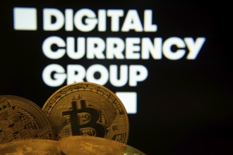 Dhaka, Bangladesh- 03 Oct 2025: Close-up of Bitcoin coins with the digital currency group logo