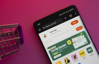 Dhaka, Bangladesh- 03 Oct 2025: A smartphone displaying the Daraz website with a shopping cart is