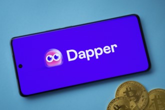 Dhaka, Bangladesh- 03 Oct 2025: Dapper logo on smartphone screen near Bitcoin coin and QR code on