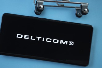 Dhaka, Bangladesh- 03 Oct 2025: Smartphone screen showing the Delticom logo with shopping cart