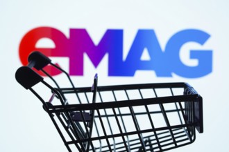 Dhaka, Bangladesh- 03 Oct 2025: Silhouette of a shopping cart in front of the Emag logo,