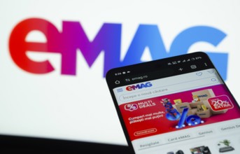 Dhaka, Bangladesh- 03 Oct 2025: Smartphone displaying Emag web interface against Emag logo