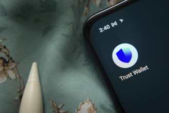 Dhaka, Bangladesh- 30 Sep 2025: Trust Wallet app icon is seen on smartphone