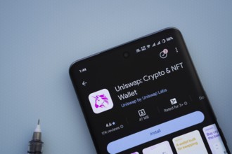 Dhaka, Bangladesh- 29 May 2025: On a blue surface, a smartphone displays the Uniswap app within the