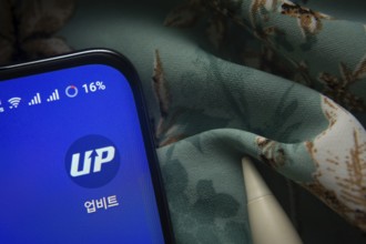 Dhaka, Bangladesh- 07 May 2025: Upbit app icon is seen on smartphone