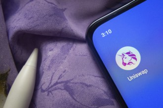 Dhaka, Bangladesh- 07 May 2025: Uniswap app icon is seen on smartphone