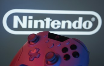 Dhaka, Bangladesh- 15 July 2025: A close-up of a gamepad with the nintendo seen on screen in the