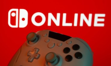 Dhaka, Bangladesh- 15 July 2025: Game controller in front of nintendo online logo on a background