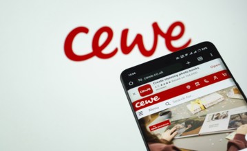 Dhaka, Bangladesh- 03 July 2025: Smartphone displaying Cewe web interface against cewe logo