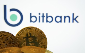 Dhaka, Bangladesh- 02 June 2025: Close-up of Bitcoin coins with the bitbank logo visible on a