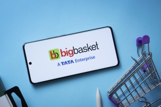 Dhaka, Bangladesh- 03 July 2025: Smartphone displaying BigBasket logo with shopping cart on a blue