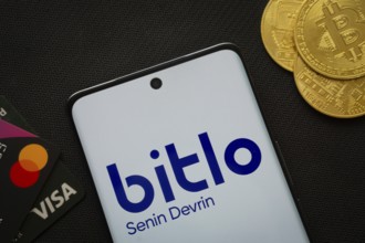 Dhaka, Bangladesh- 03 Sep 2025: Smartphone displaying Bitlo logo surrounded by Bitcoin coins and