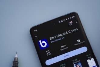 Dhaka, Bangladesh- 29 May 2025: On a blue surface, a smartphone displays the Bitlo app within the