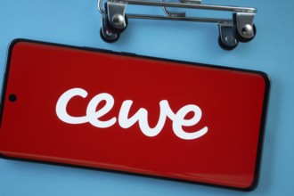 Dhaka, Bangladesh- 03 July 2025: Smartphone screen showing the Cewe logo with shopping cart wheels