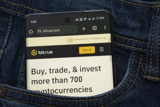 Dhaka, Bangladesh- 15 June 2025: A smartphone displaying the Bitrue.com web interface peeks out of