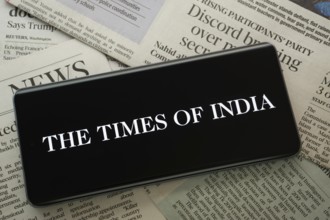 Dhaka, Bangladesh - 18 March 2025: The logo of the times of india is displayed on a smartphone
