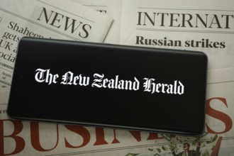 Dhaka, Bangladesh - 18 March 2025: The logo of the new zealand herald is displayed on a smartphone