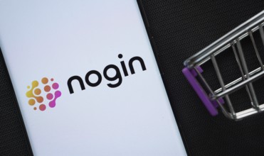 Dhaka, Bangladesh- 03 July 2025: A smartphone displaying the nogin logo next to a miniature