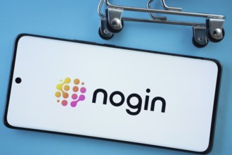 Dhaka, Bangladesh- 03 July 2025: Smartphone screen showing the nogin logo with shopping cart wheels