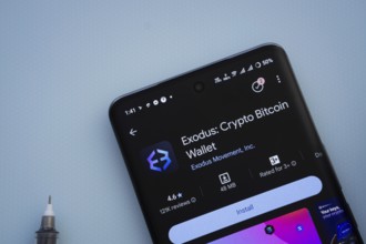 Dhaka, Bangladesh- 29 May 2025: On a blue surface, a smartphone displays the Exodus app within the