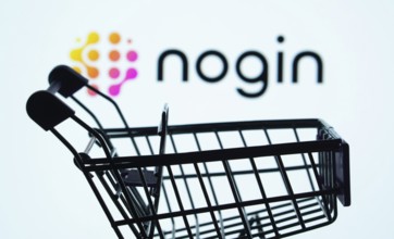 Dhaka, Bangladesh- 03 July 2025: Silhouette of a shopping cart in front of the nogin logo,