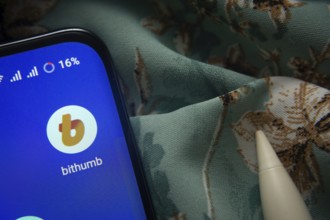 Dhaka, Bangladesh- 07 May 2025: Bithumb app icon is seen on smartphone