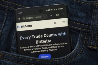 Dhaka, Bangladesh- 15 June 2025: A smartphone displaying the BitDelta.com web interface peeks out