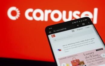 Dhaka, Bangladesh- 03 July 2025: Smartphone displaying Carousell web interface against carousel