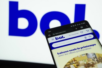 Dhaka, Bangladesh- 03 July 2025: Smartphone displaying bol web interface against bol logo
