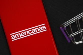 Dhaka, Bangladesh- 03 July 2025: A smartphone displaying the Americanas logo next to a miniature