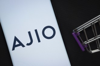 Dhaka, Bangladesh- 03 July 2025: A smartphone displaying the AJIO logo next to a miniature shopping