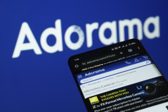 Dhaka, Bangladesh- 03 July 2025: Smartphone displaying Adorama web interface against adorama logo