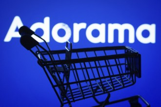Dhaka, Bangladesh- 03 July 2025: Silhouette of a shopping cart in front of the Adorama logo,