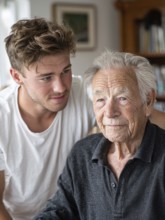 A young carer lovingly looks after a senior in an old people's home, nursing home, symbolic image