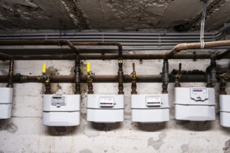 Several gas meters and pipes in a cellar in Düsseldorf, Germany