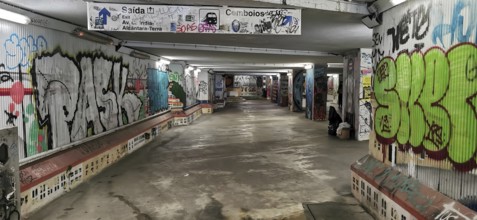 Graffiti-decorated tunnel with colorful murals and urban atmosphere, subway station, Lisbon,
