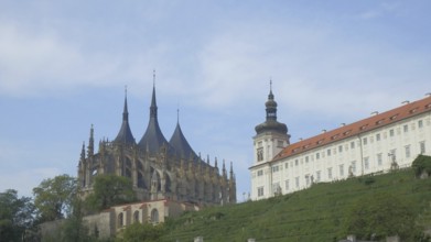 Historical ossuary, ossuary, Sedlec bone church, with towers under a blue sky, Kutna Hora, Czech