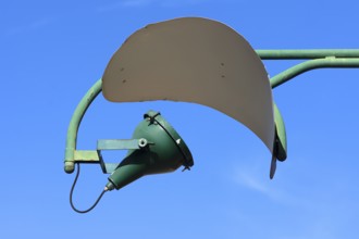 Old spotlight with reflector on a factory building, Giudecca Island, Veneto, Italy