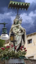 Sculpture of the Virgin and Child under a canopy, Venice, Veneto, Italy