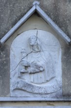 Old relief on the Monastereo Clarisse SS. Trinita on Guidecca Island, Veneto, Italy