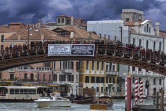 Crowds of tourists on the Ponte dell'Accademia in high season, Venice, Veneto, Italy