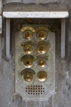 Brass bells on a residential building, Venice, Veneto, Italy