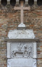 Bas-relief on the church of San Martino Vescovo from 1534, Saint Martin sharing his mantle to the