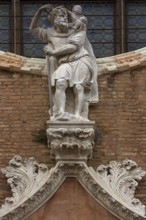 Sculpture of Christopher above the entrance portal of the Madlonna dell'Orto parish church, around
