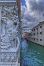 Relief of the drunken Noah at the Doge's Palace, in the back the Bridge of Sighs, Venice, Veneto,