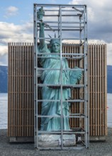 Art object, Statue of Liberty in a cage, village Lyngen, Lyngen Alps, Norway