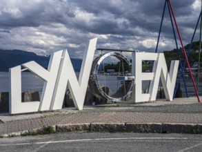 Letter sculpture with the name of the village of Lyngen, Lyngen Alps, Norway
