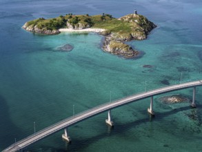 Sommaroy Bridge connecting Kvaloya Island to Sommaroy Island, small islands, turquoise water,