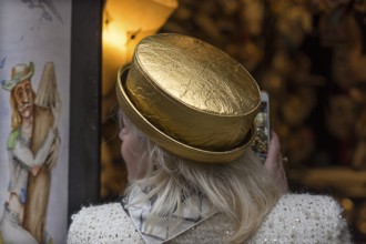 Woman wearing a golden hat, Venice, Veneto, Italy